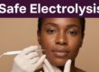 A Black woman receives gentle facial electrolysis from a gloved electrologist.