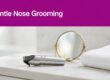 A nose hair trimmer sits beside a mirror and folded towel below a fuchsia headline band.