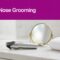 A nose hair trimmer sits beside a mirror and folded towel below a fuchsia headline band.